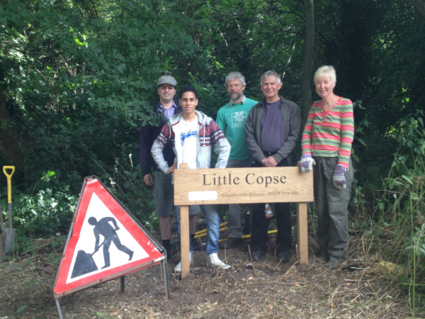 The volunteers and their sign